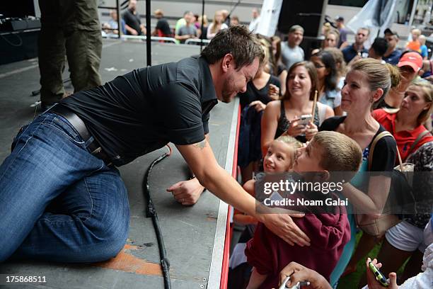 Mike Eli of Eli Young Band speaks with fans during "FOX & Friends" All American Concert Series outside of FOX Studios on August 9, 2013 in New York...