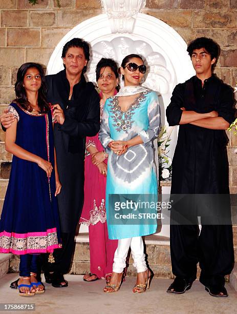 Indian Bollywood actor Shah Rukh Khan , pictured with his family ; daughter Suhana, sister Shehnaz, wife Gauri Khan and son Aryan Khan, pose during...