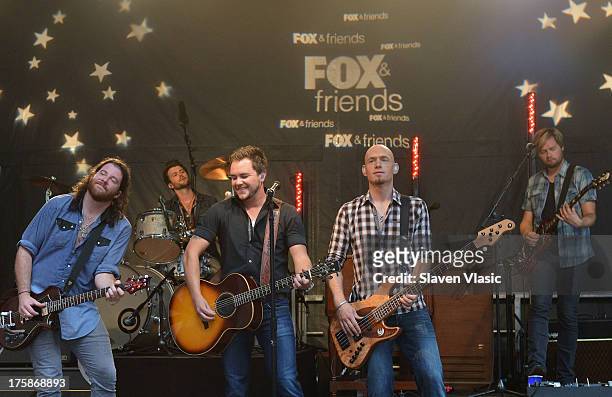 James Young, Chris Thompson, Mike Eli and Jon Jones of Eli Young Band perform during "FOX & Friends" All American Concert Series outside of FOX...