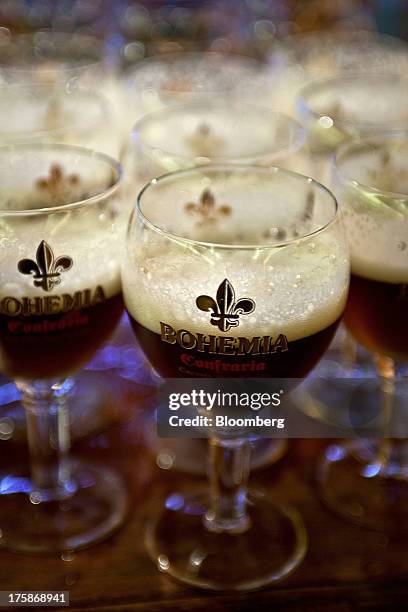 Glasses of Cia. De Bebidas das Americas Bohemia brand beer are arranged for a photograph at a restored Bohemia brewery in Petropolis, Brazil, Sunday,...