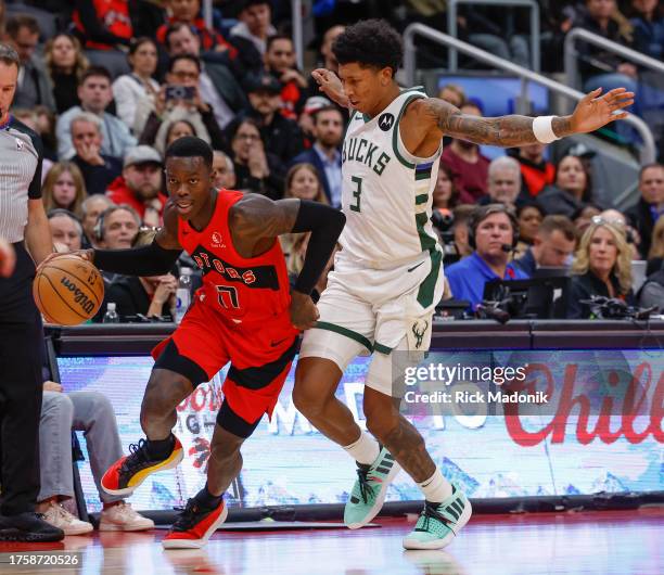 Toronto Raptors guard Dennis Schroder turns the corner and slips past Milwaukee Bucks forward MarJon Beauchamp . Toronto Raptors vs Milwaukee Bucks...