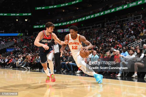 De'Andre Hunter of the Atlanta Hawks dribbles the ball during the game against the Washington Wizards on November 1, 2023 at State Farm Arena in...