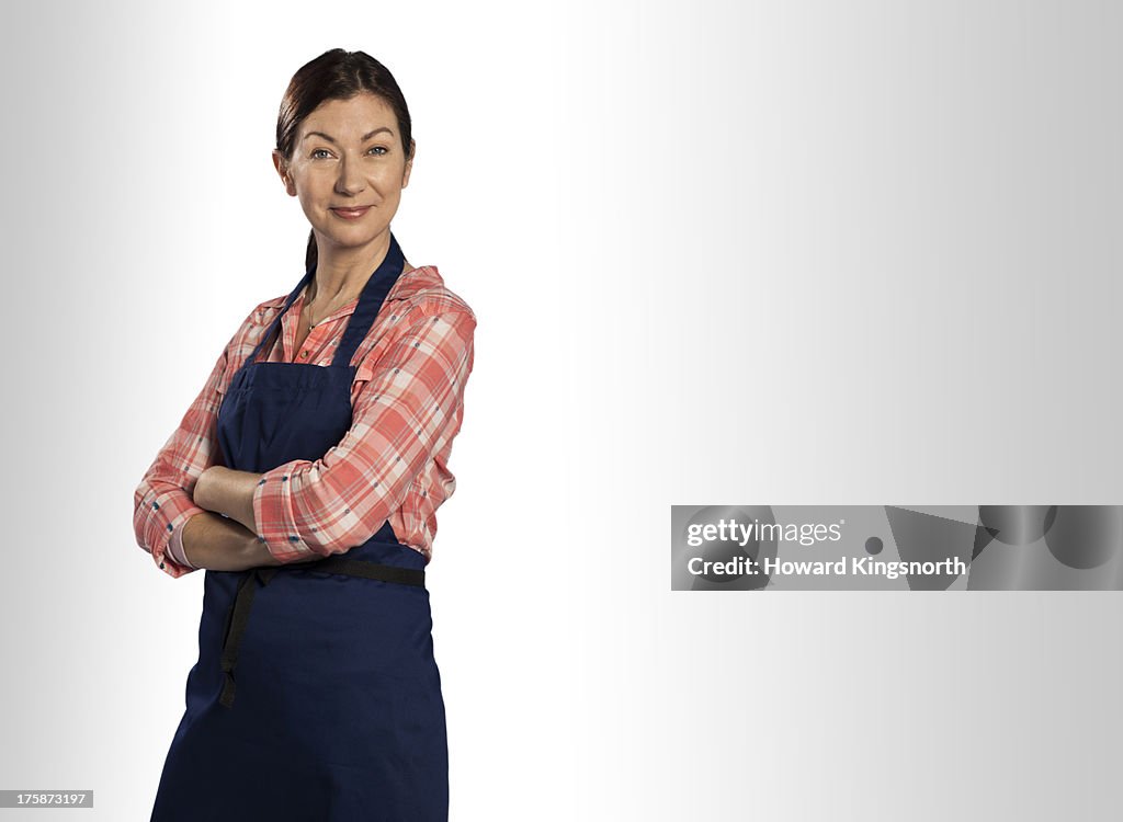 Mature female wearing apron