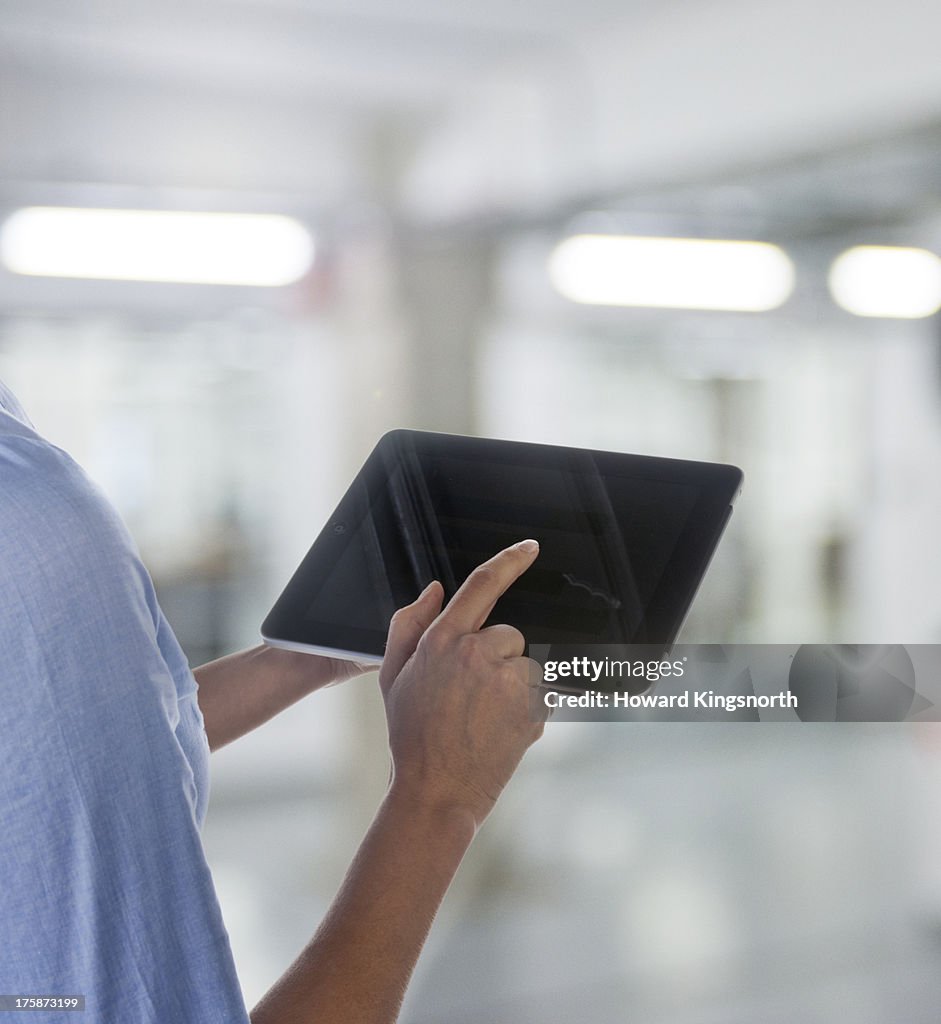 Female hands and tablet device