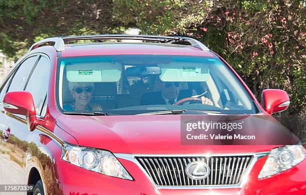 Lynn Bynes and Rick Bynes, Amanda Bynes' parents, depart after a hearing which granted them temporary conservatorship and extended Bynes hospital...