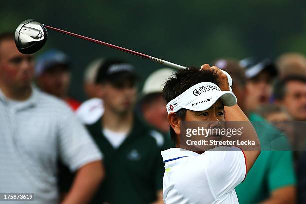 Hiroyuki Fujita of Japan watches his tee shot on the first hole during the second round of the 95th PGA Championship on August 9, 2013 in Rochester,...