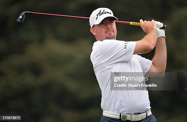 Robert Garrigus of the United States hits his tee shot on the seventh hole during the second round of the 95th PGA Championship on August 9, 2013 in...