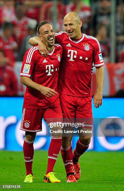 Arjen Robben and Franck Ribery of Muenchen celebrate the opening goal during the Bundesliga match between FC Bayern Muenchen and Borussia...