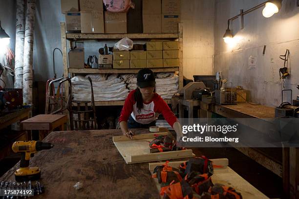 Geologist arranges rock samples in a core shack at a Century Iron Mines Corp. Mapping and prospecting site near Schefferville, Quebec, Canada, on...
