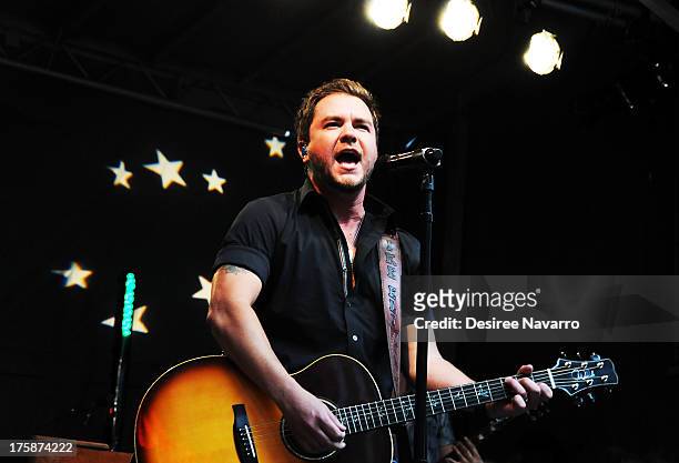 Mike Eli of the Eli Young Band performs during "FOX & Friends" All American Concert Series outside of FOX Studios on August 9, 2013 in New York City.
