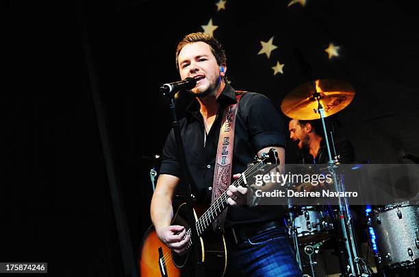 Mike Eli of the Eli Young Band performs during "FOX & Friends" All American Concert Series outside of FOX Studios on August 9, 2013 in New York City.