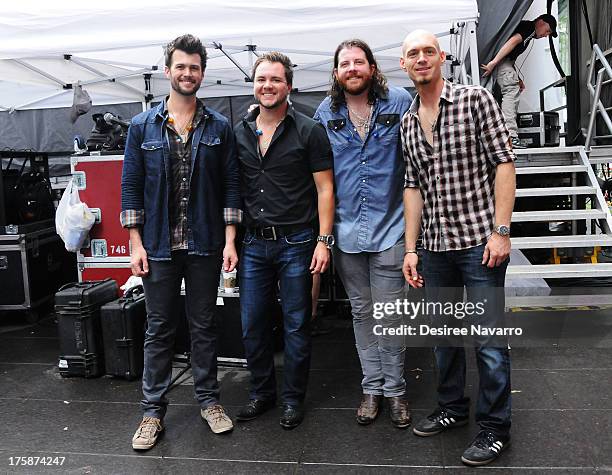 Chris Thompson, Mike Eli, James Young and Jon Jones of Eli Young band visit "FOX & Friends" All American Concert Series outside of FOX Studios on...