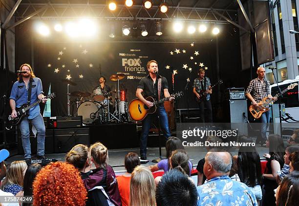 Guitarist James Young, drummer Chris Thompson, singer Mike Eli and bassist Jon Jones of Eli Young Band perform during "FOX & Friends" All American...