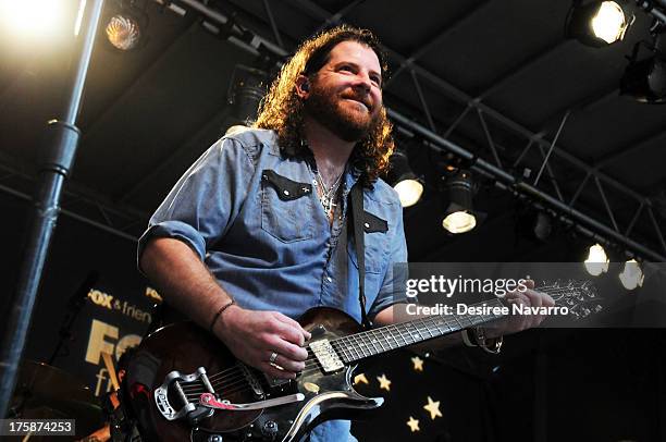 Guitartist James Young of Eli Young Band performs during "FOX & Friends" All American Concert Series outside of FOX Studios on August 9, 2013 in New...