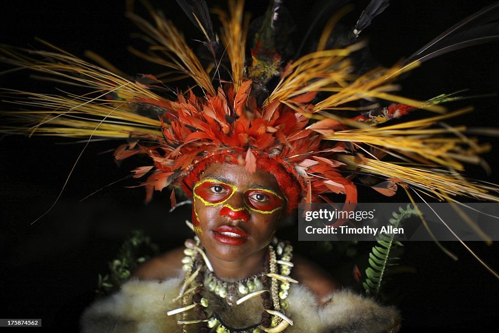 Woman with feather and grass headdress