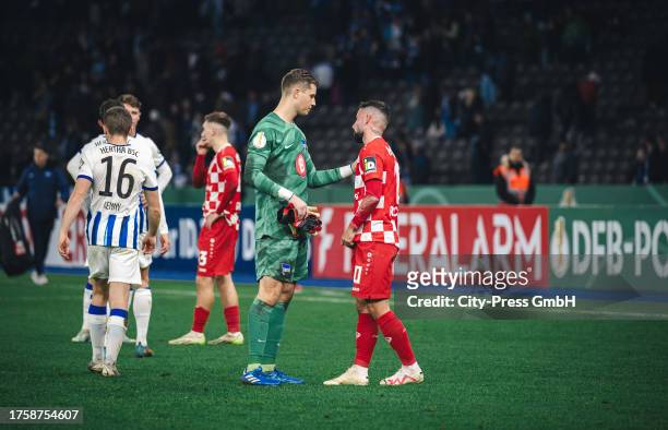 Tjark Ernst of Hertha BSC talks with Marco Richter of 1. FSV Mainz 05 during the DFB Cup match between Hertha BSC and 1. FSV Mainz 05 on November 1,...