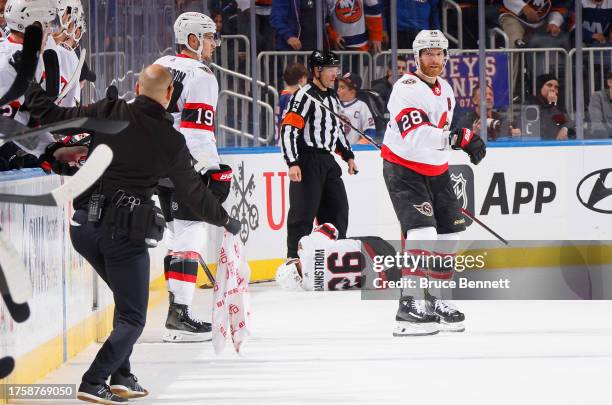 Erik Brannstrom of the Ottawa Senators is injured on a check by Cal Clutterbuck of the New York Islanders d2pat UBS Arena on October 26, 2023 in...