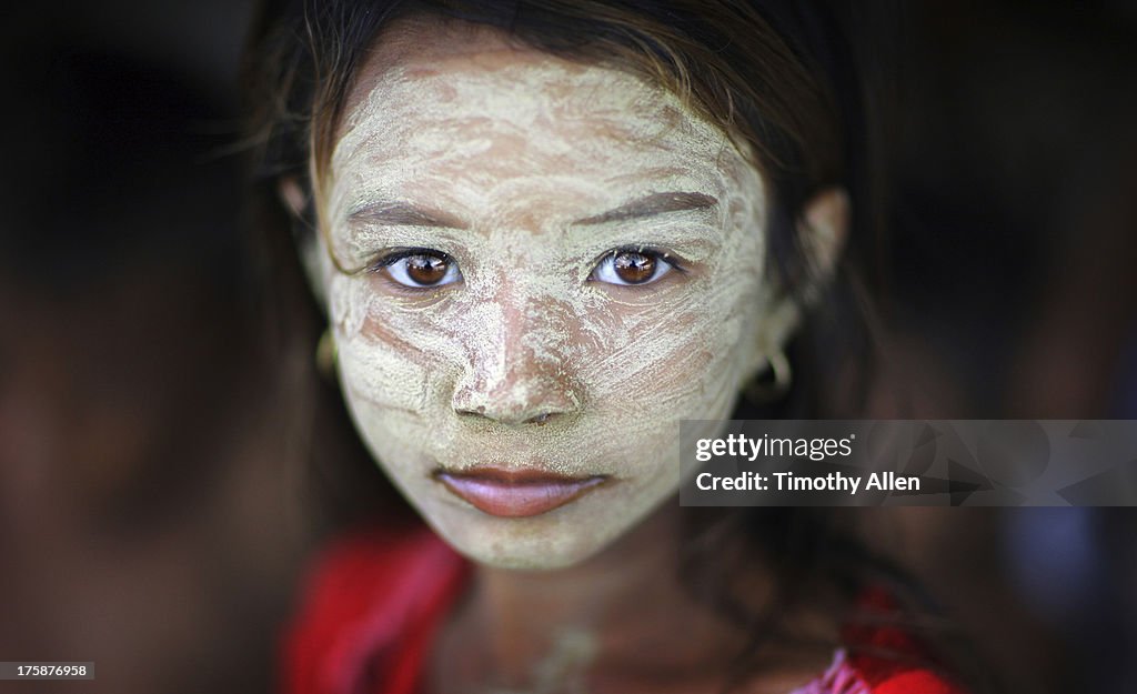 Bajau sea gypsy girl with face mask on houseboat