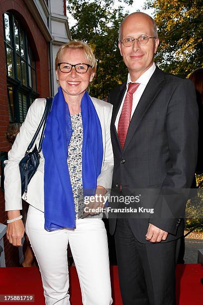 Peter Tschentscher and his wife Eva-Maria Tschntscher attend the 'Nacht der Medien 2013' on August 09, 2013 in Hamburg, Germany.