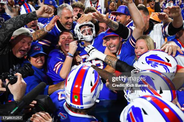 Dalton Kincaid of the Buffalo Bills celebrates after scoring a touchdown against the Tampa Bay Buccaneers during the second quarter of the game at...
