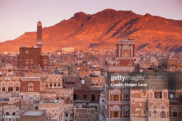 view over old town sana'a rooftops at sunset - sanaa stock pictures, royalty-free photos & images