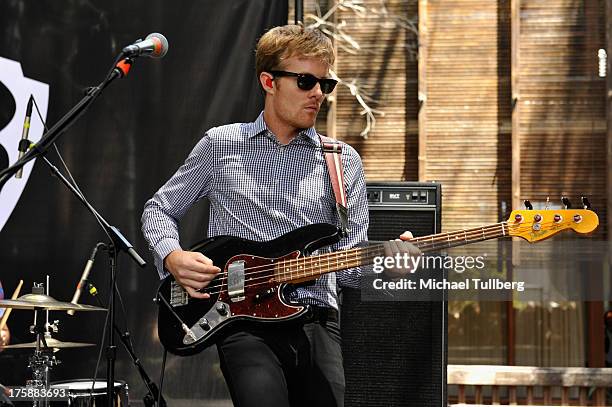 Bassist Steven Jeffery of Atlas Genius performs live at Warner Bros. Records Boutique Store on August 9, 2013 in Burbank, California.