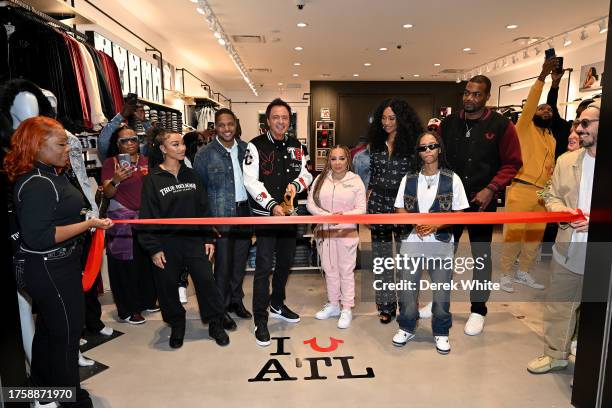 Zonnique Pullins, Michael Buckley, Tiny Harris, Cynthia Bailey, Heaven Anderson, and Paul Millsap attend True Religion ATL Grand Opening event at...