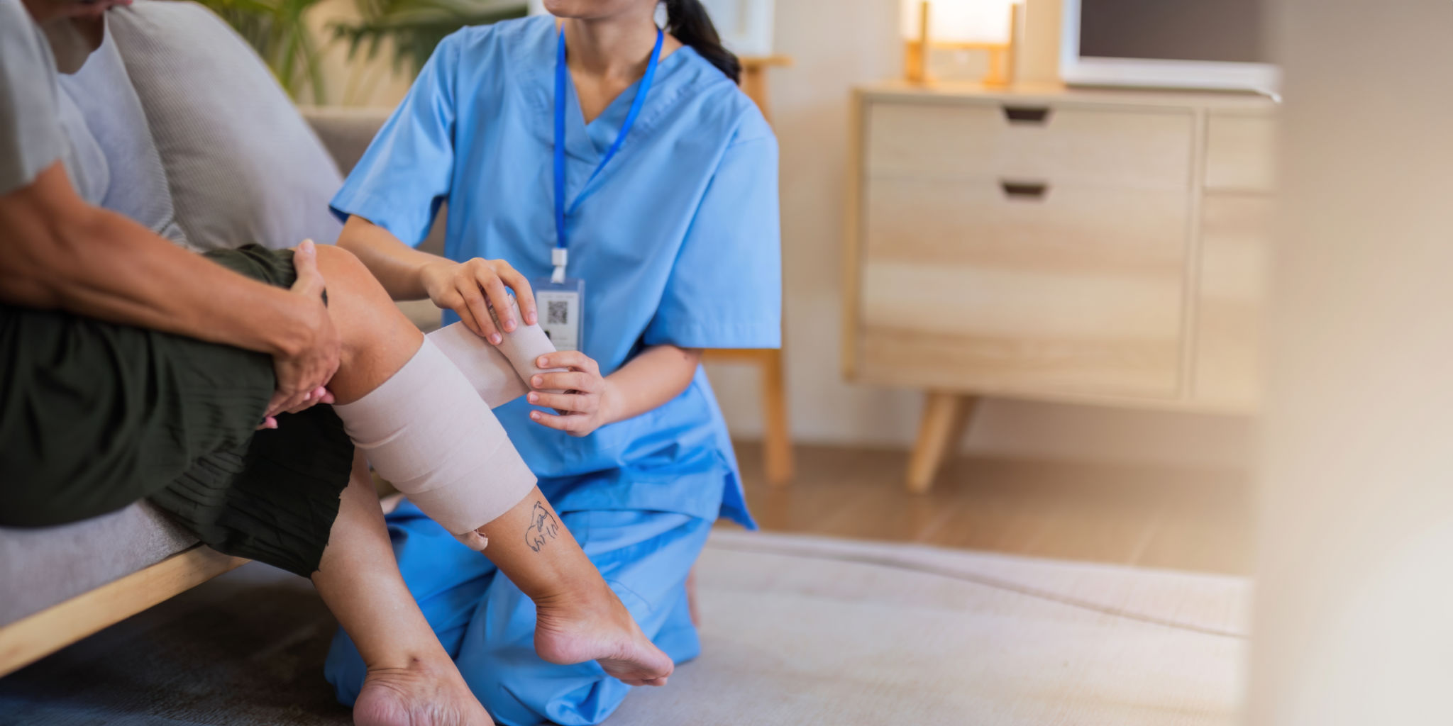 Physical therapist caregiver Asian and Caucasian senior women trust moving hand in rehabilitation. Physiotherapy healthcare, Medical caregiver consulting disabled elderly patient at home Physical therapist caregiver Asian and Caucasian senior women trust moving hand in rehabilitation. Physiotherapy healthcare, Medical caregiver consulting disabled elderly patient at home