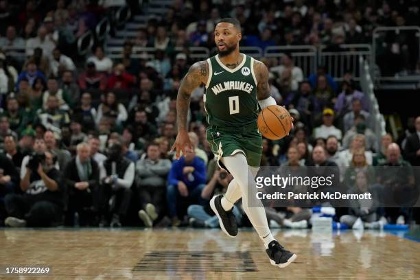 Damian Lillard of the Milwaukee Bucks dribbles the ball against the Philadelphia 76ers in the first half at Fiserv Forum on October 26, 2023 in...