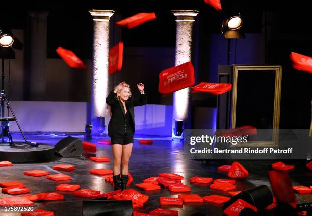 Christelle Chollet during the traditional throw of cushions at the final of her one woman show "The New Show", written and set stage by Remy Caccia...