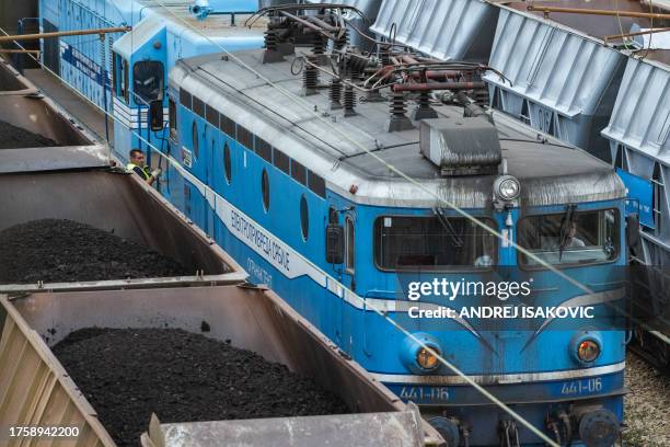 This photograph taken on October 27 shows trains delivering coal to the "Nikola Tesla A" power plant near Obrenovac, 40km west of Belgrade. Every...