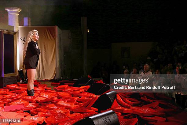 Christelle Chollet during the traditional throw of cushions at the final of her one woman show "The New Show", written and set stage by Remy Caccia...