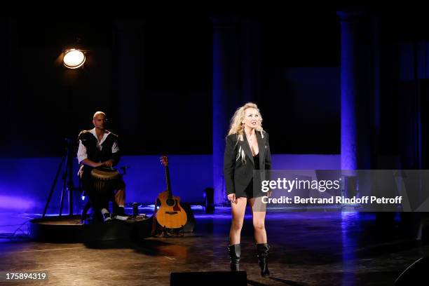 Musician Raphael Alazraki and Christelle Chollet perform in Christelle Chollet one woman show "The New Show", written and set stage by Remy Caccia at...