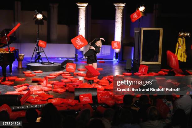 Christelle Chollet during the traditional throw of cushions at the final of her one woman show "The New Show", written and set stage by Remy Caccia...