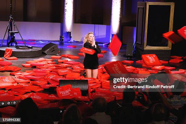 Christelle Chollet during the traditional throw of cushions at the final of her one woman show "The New Show", written and set stage by Remy Caccia...