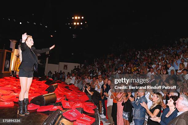 Christelle Chollet during the traditional throw of cushions at the final of her one woman show "The New Show", written and set stage by Remy Caccia...