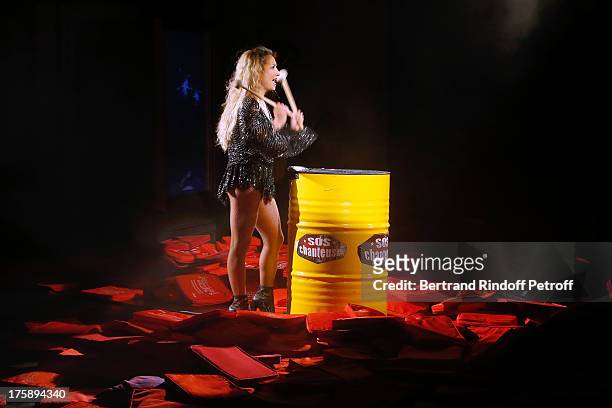 Christelle Chollet performs after the traditional throw of cushions at the final of her one woman show "The New Show", written and set stage by Remy...