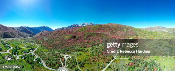 panoramic aerial photo of mountains with fall colors and blue sky - mt timpanogos stock pictures, royalty-free photos & images