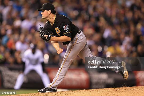 Relief pitcher Vin Mazzaro of the Pittsburgh Pirates delivers against the Colorado Rockies at Coors Field on August 9, 2013 in Denver, Colorado.