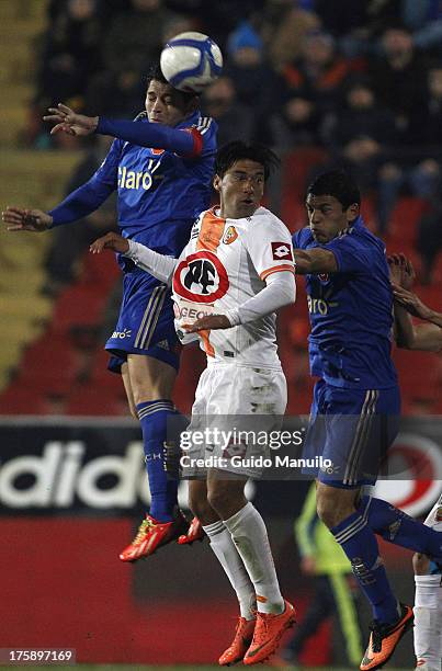 Jose Rojas of Universidad de Chile , struggles for the ball with Alexis Salazar of Cobresal during a match between Universidad de Chile and Cobresal...