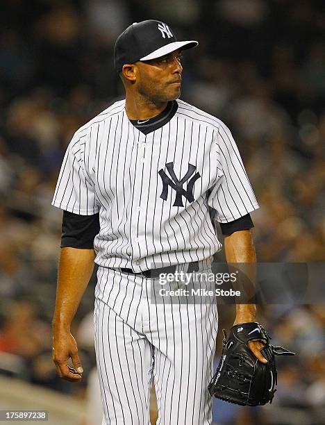 Mariano Rivera of the New York Yankees walks off the mound after giving up a game tying two run home run to Miguel Cabrera of the Detroit Tigers in...