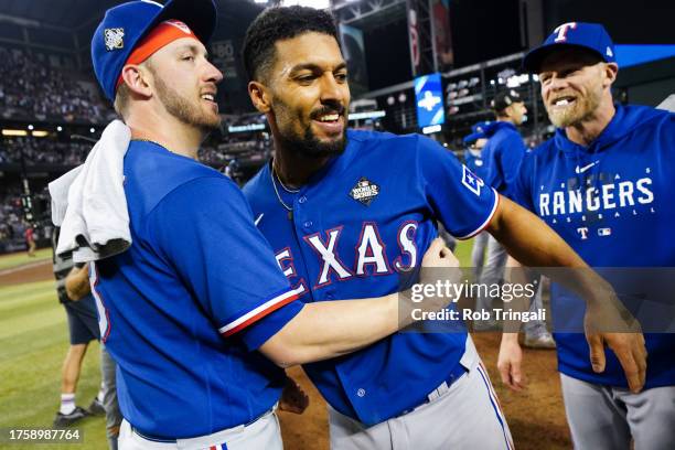 Mitch Garver and Marcus Semien of the Texas Rangers celebrate after winning Game 5 of the 2023 World Series between the Texas Rangers and the Arizona...