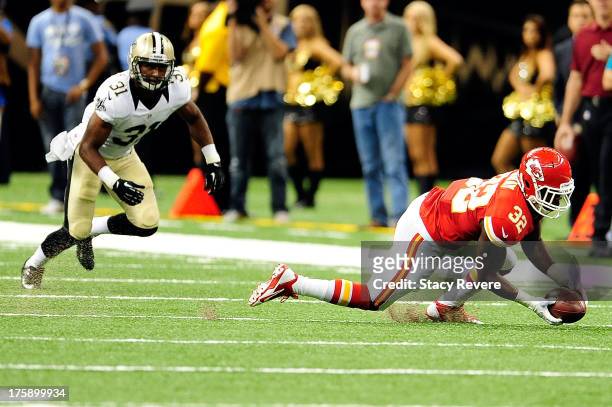Cyrus Gray of the Kansas City Chiefs catches a pass in front of Dion Turner of the New Orleans Saints during a game at the Mercedes-Benz Superdome on...