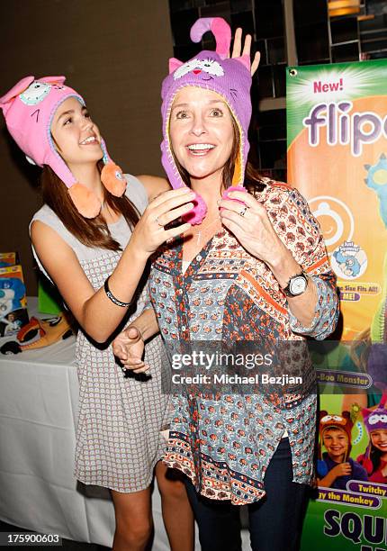 Actress Bailee Madison and mother Patricia Riley pose with Flipeez At KIIS FM Pre-Teen Choice Awards Gifting Suite on August 9, 2013 in Los Angeles,...