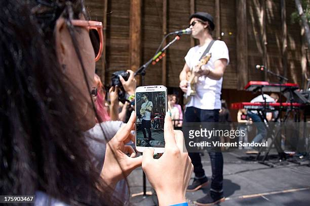 Singer/guitarist Keith Jeffery of Atlas Genius performs at the WBR Summer Sessions at Warner Bros. Records boutique store on August 9, 2013 in...