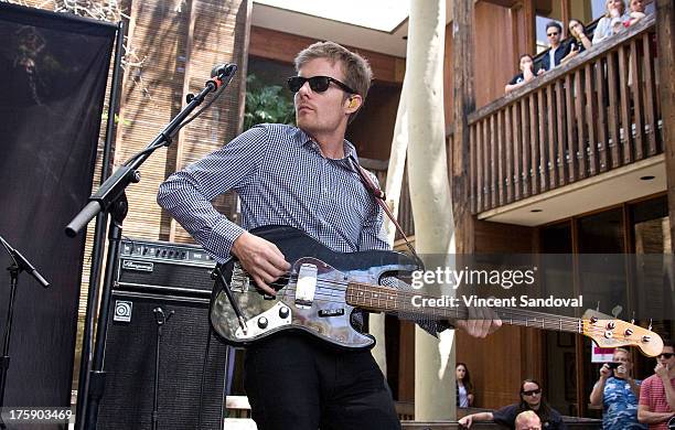 Bassist Steven Jeffery of Atlas Genius performs at the WBR Summer Sessions at Warner Bros. Records boutique store on August 9, 2013 in Burbank,...