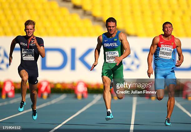 Kevin Mayer of France, Carlos Chinin of Brazil and Ilya Shkurenev of Russia compete in the Men's Decathlon 100 metres during Day One of the 14th IAAF...