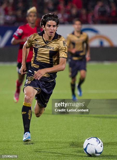 Carlos Orrantia of Pumas drives the ball with during a match between Tijuana and Pumas as part of Apertura 2013 Liga MX, at Caliente Stadium, on...