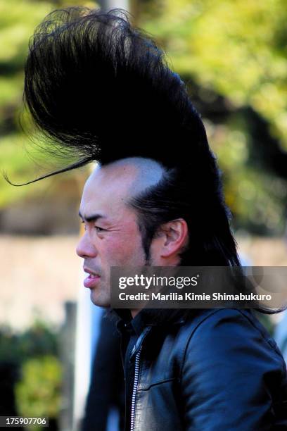Japanese rockabilly dancer showing off an impressive hairdo at yoyogi park in Tokyo.