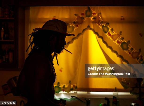 Greensboro, NC - August 7 - Noah Amerson makes dinner for his sons Malikah Pon and Micah Amerson at his home in Greensboro, NC on Wednesday, August...